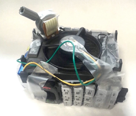 Figure built from a PC van, mobile keyboard and other electronic parts.