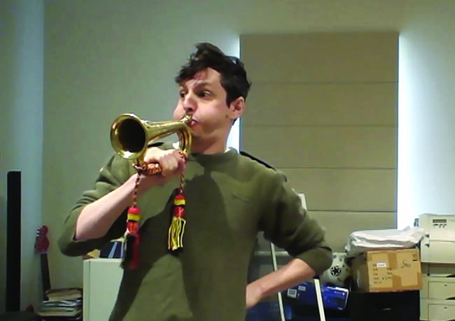Man blowing a trumpet.